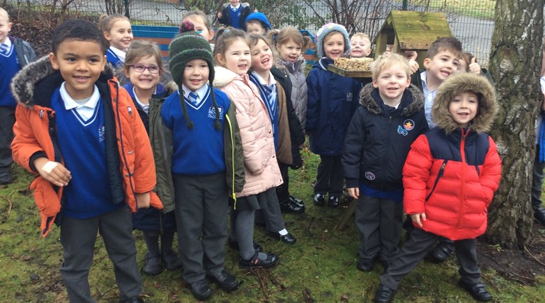 Reception class make bird feeders 