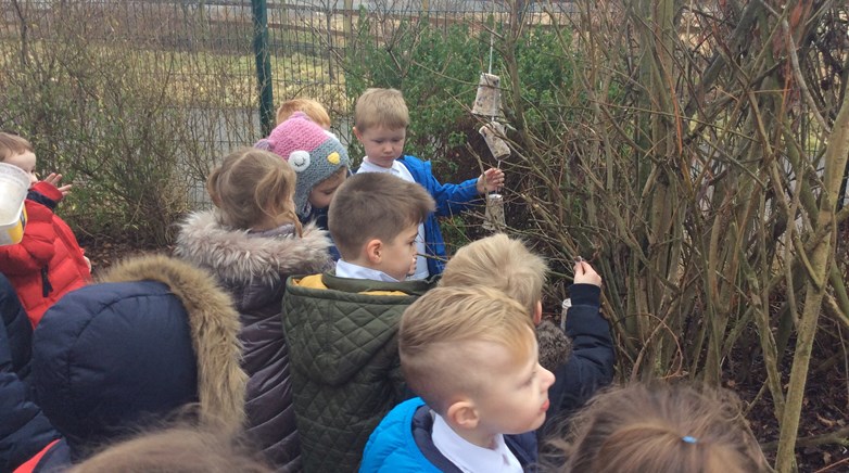 Reception class make bird feeders 
