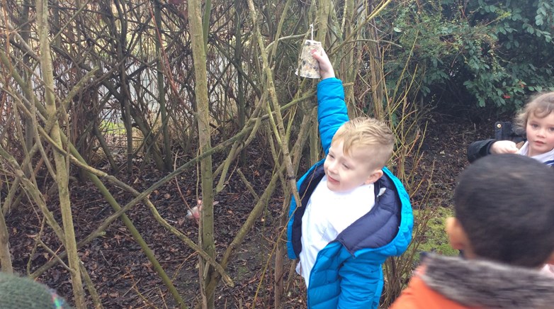 Reception class make bird feeders 